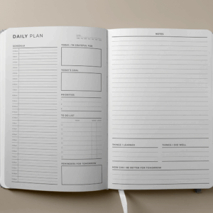 Daily planner interior showing undated layout with goal and habit trackers.